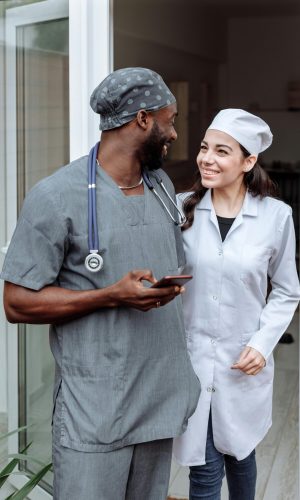 pexels-photo-5327874-5327874 Medical team stands together, showcasing unity and professionalism in healthcare environment.
